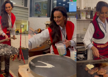 Xhuli gatuan ushqime tradicionale për shqiptarët në një restorant në Zvicër